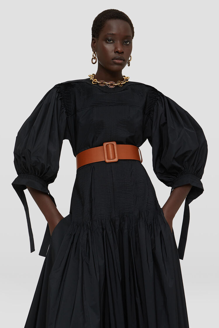 Long dress with pintucks on shoulders and skirt